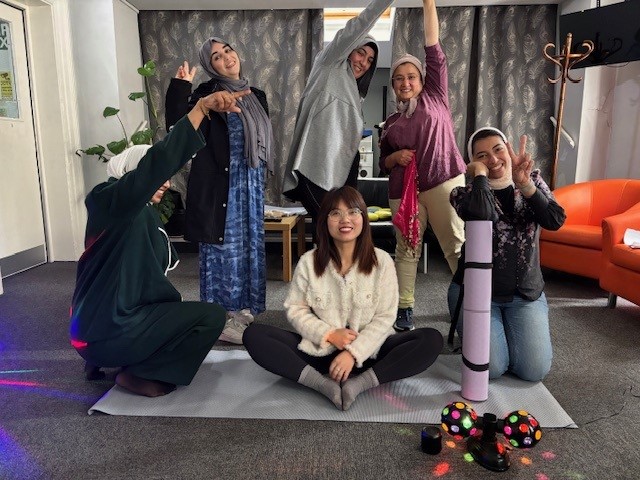 Ladies striking a pose in their dance group.