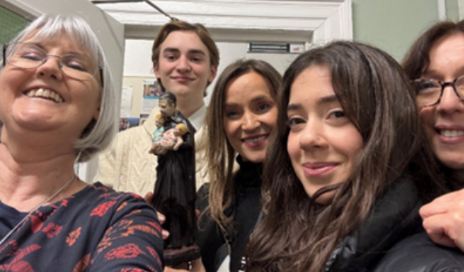 Deaf centre volunteers taking selfie.