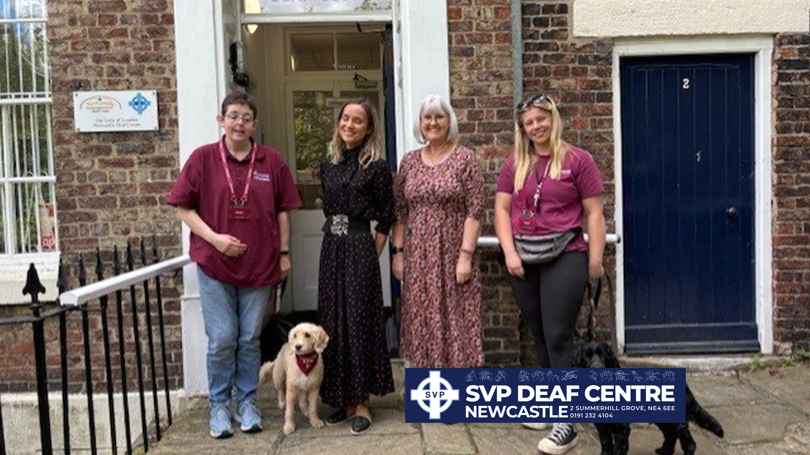 Outside the Newcastle Deaf Centre with dogs.