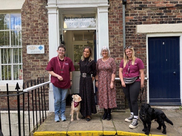 Outside the Newcastle Deaf Centre with dogs.