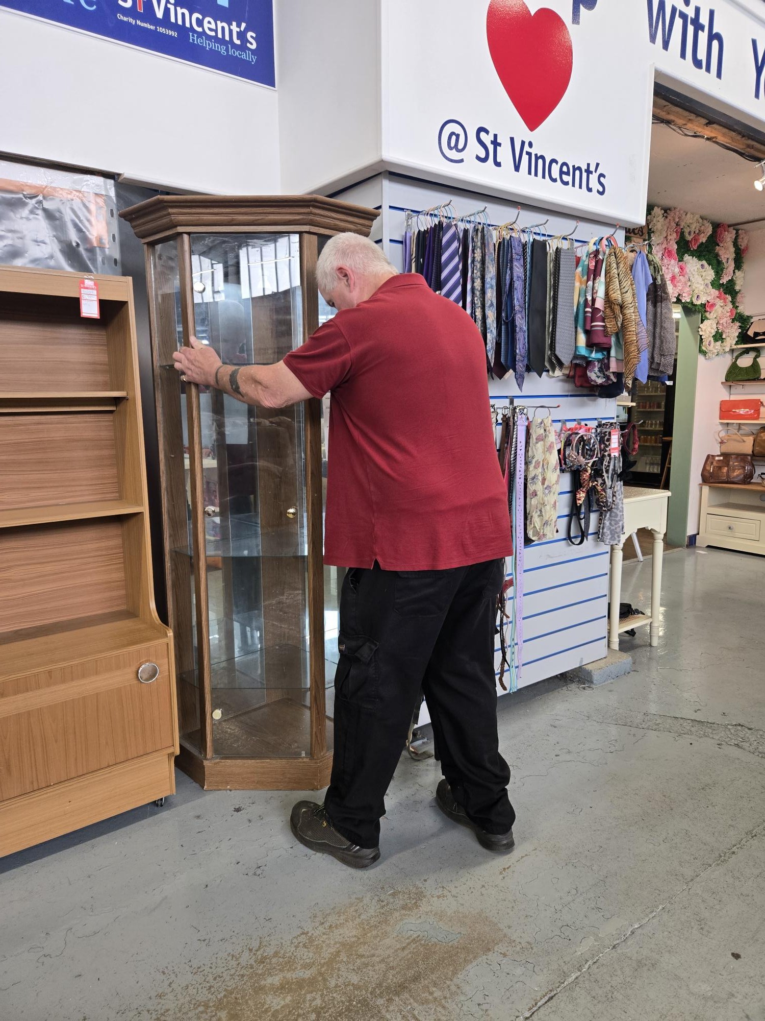 volunteer adjusting display