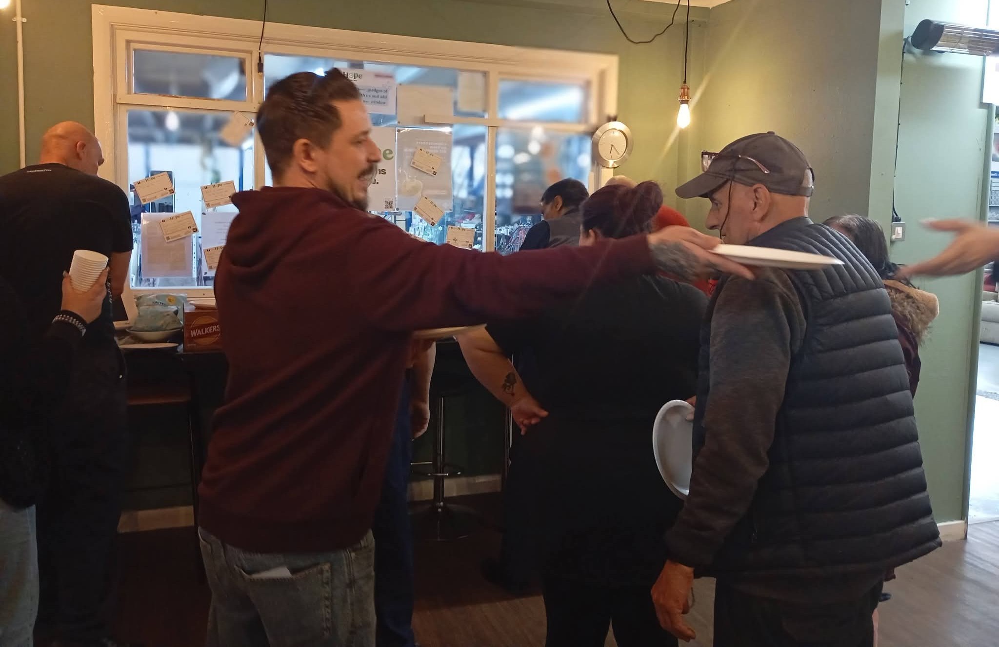 man giving a paper plate to someone