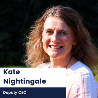 Photo of Kate Nightingale, Deputy CEO, against grassy background