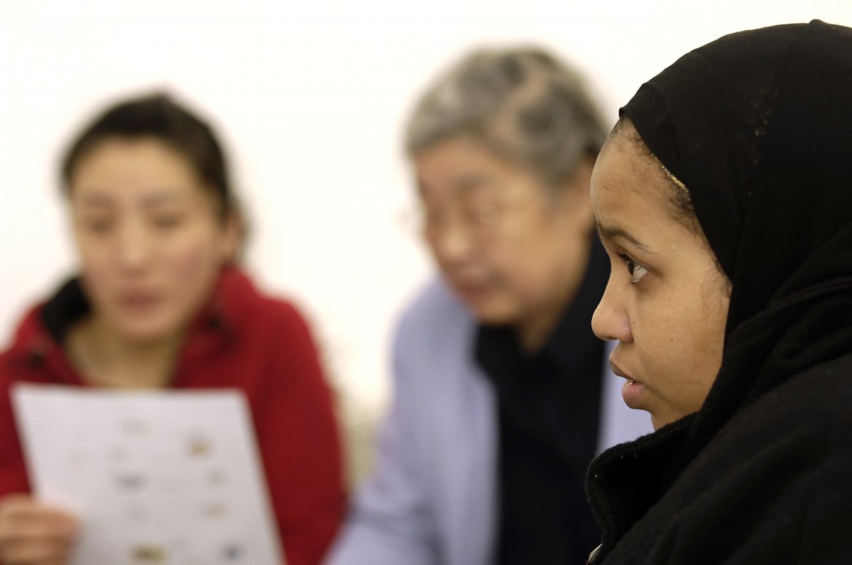 Somali woman in hajib and Asian ladies in ESOL class